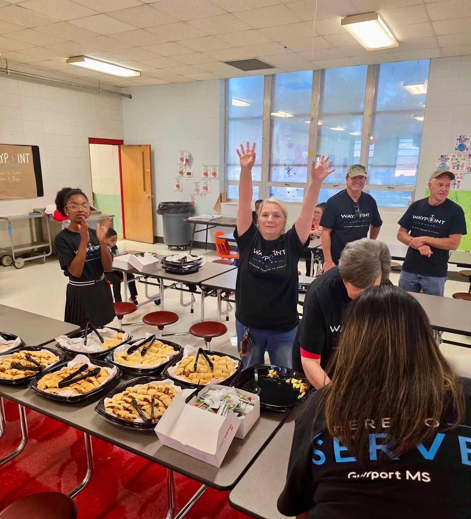 Waypoint volunteers serving lunch to Gulfport teachers